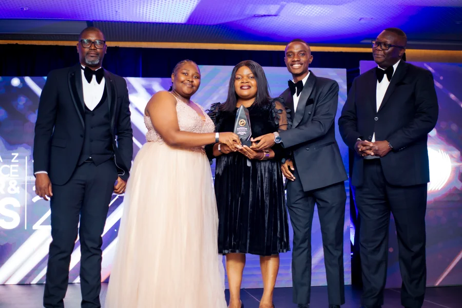 A group celebrating an award at the 2025 ICTAZ Gala.